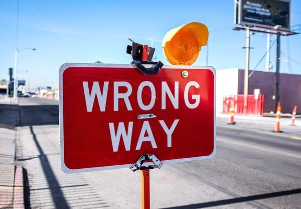 red Wrong Way signage on road